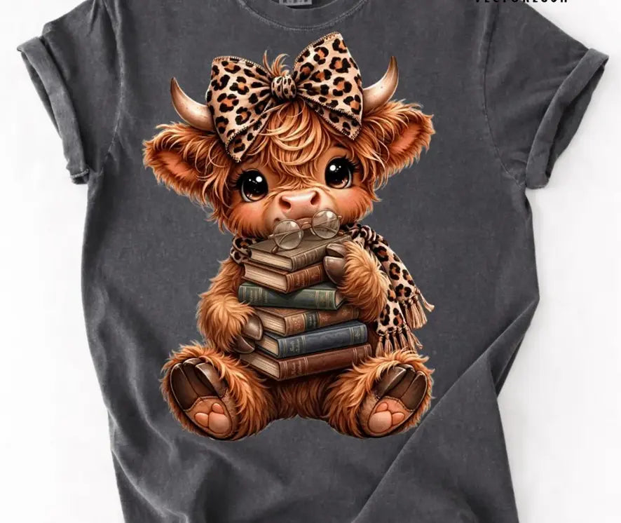 Highland cow with books brandedbybarta